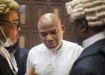Nnamdi Kanu life sentence court gavel and Nigerian flag background.
